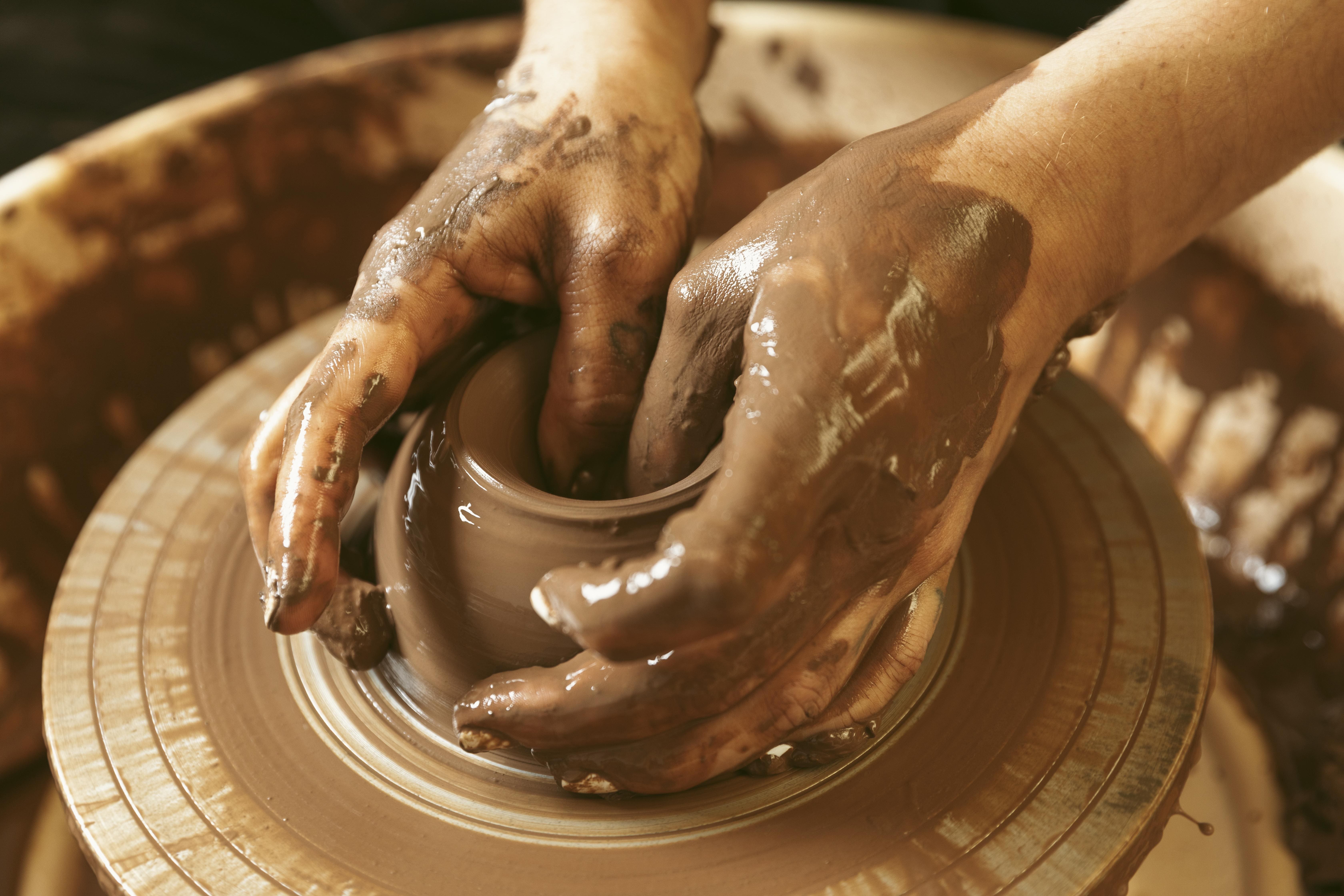 Person doing pottery