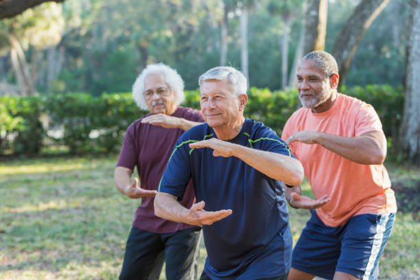 Group of seniors practicing Tai Chi outdoors