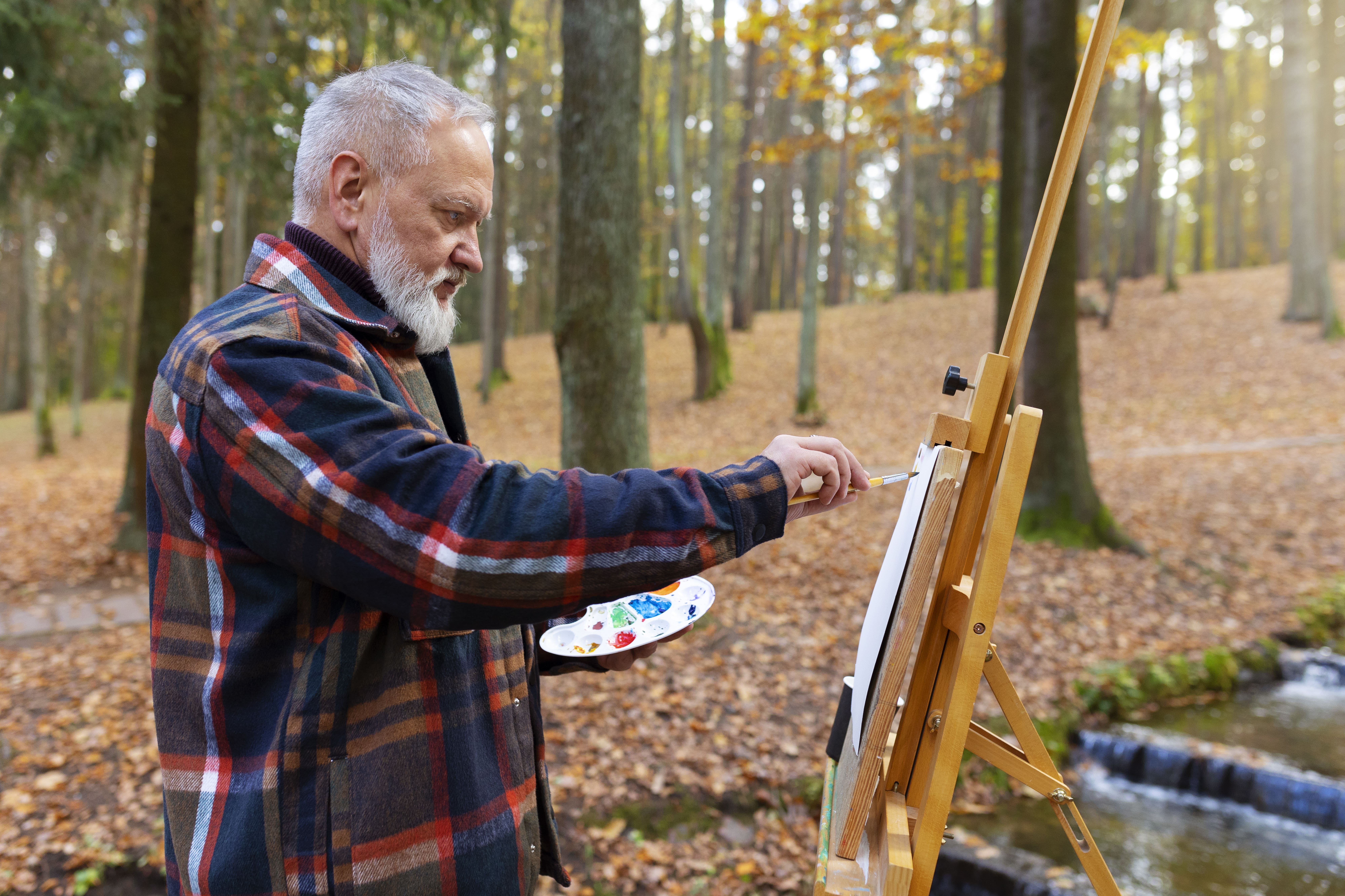 Person painting a canvas
